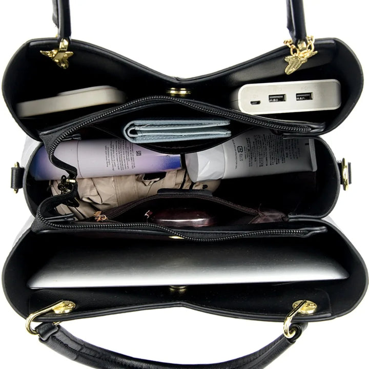 Elegant black shoulder bag with stylish charms