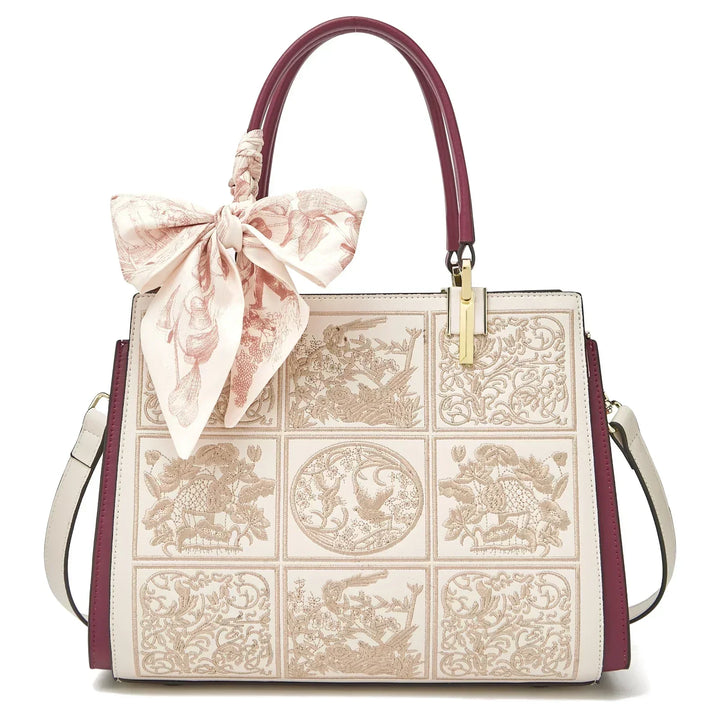 Sylvia™ – Unique crossbody bag with embroidery and bow