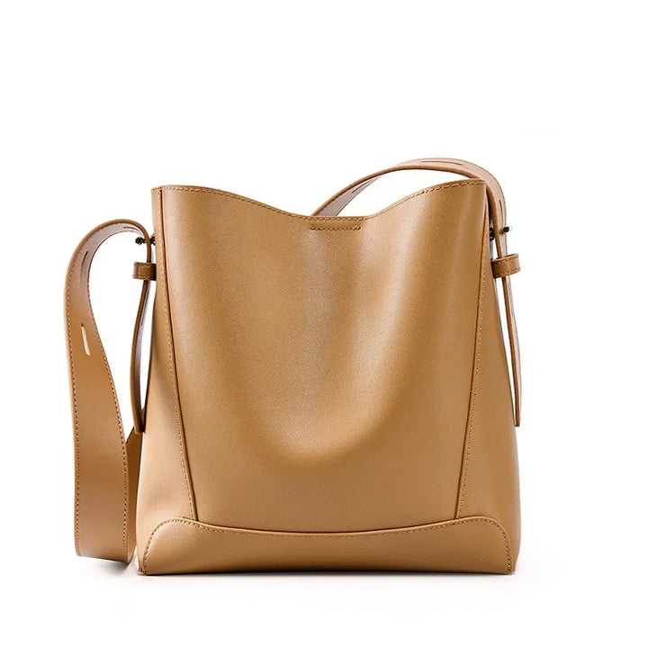 tine™ – Elegant shoulder bag in a sandy shade with strap-inspired handles