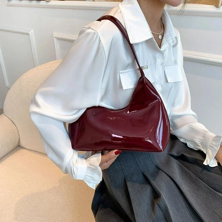 Elegant burgundy shoulder bag with a patent finish