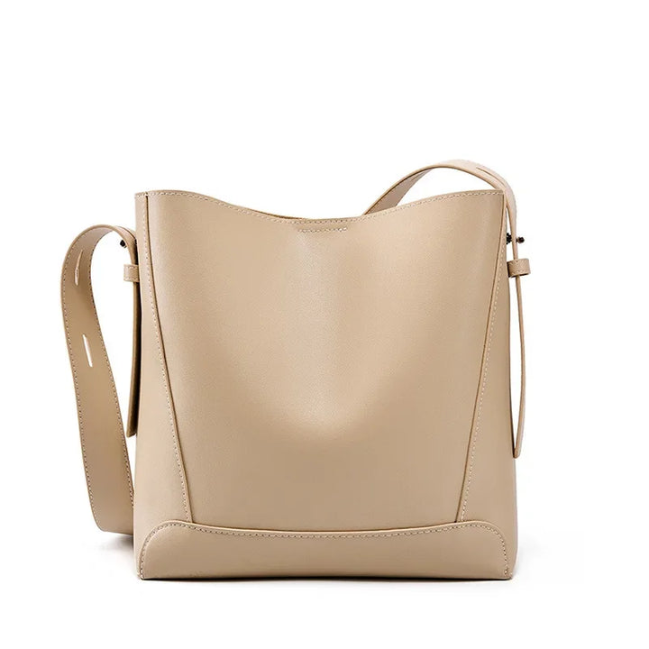tine™ – Elegant shoulder bag in a sandy shade with strap-inspired handles